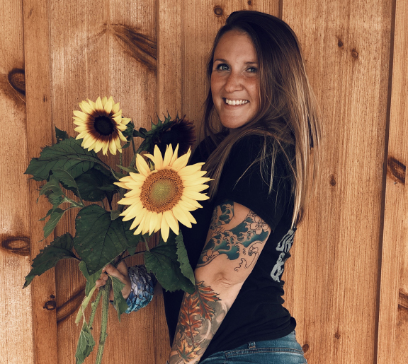 Student photo holding flowers